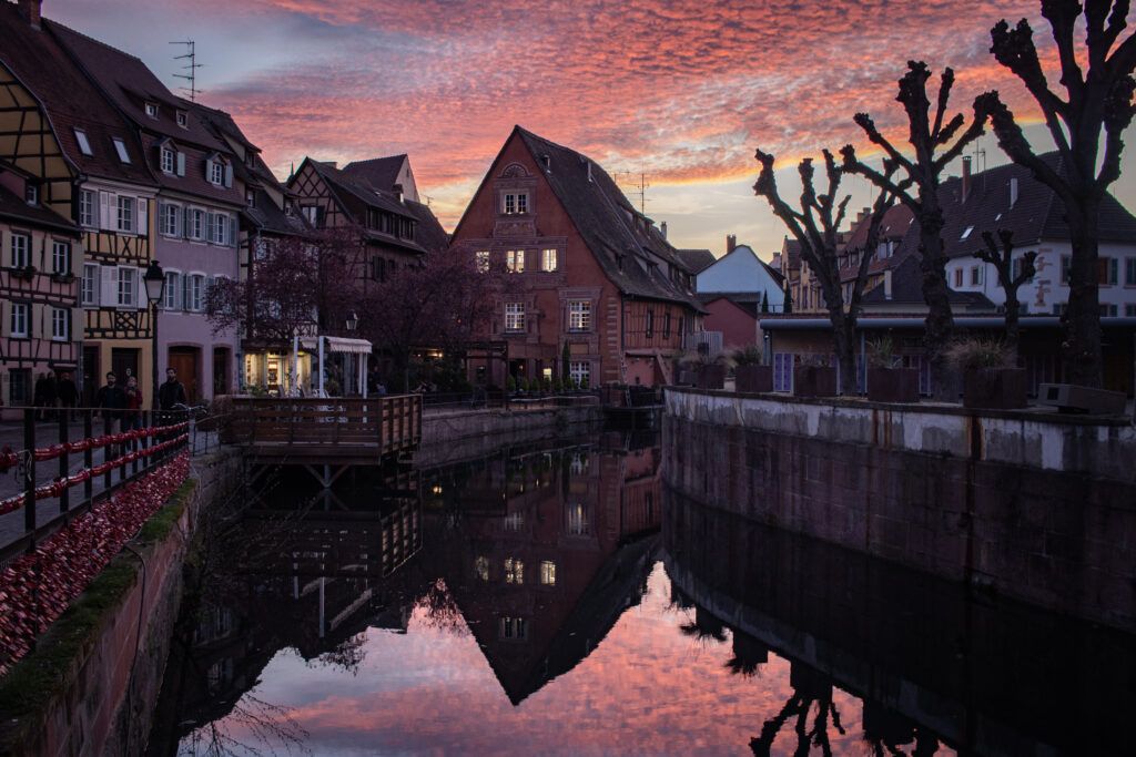 A sunset over a small waterway in Colmar, France. 