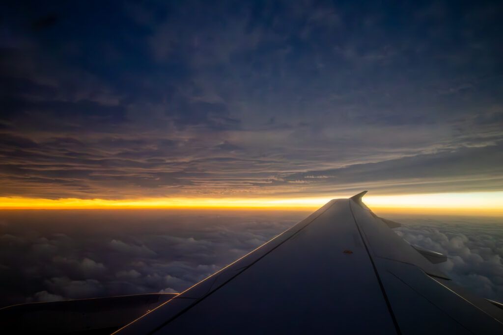 An image of a solar eclipse totality from the window of an airplane. 